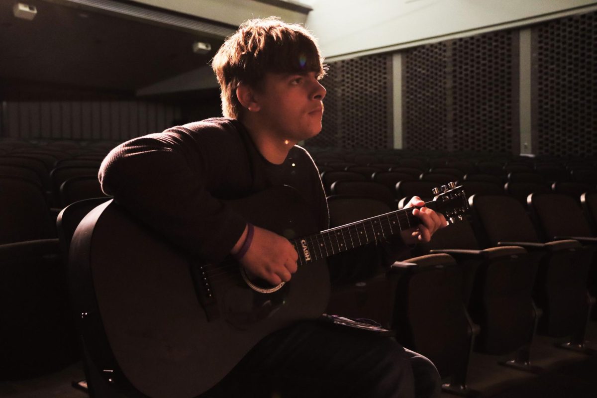Senior Travis Casteel practices his part of a special act, ‘Edelweiss’, on the guitar in preparation for the concert this week. Junior Mikaela Tymony presented the idea of singing the song as a duet to Casteel.