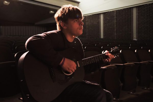 Senior Travis Casteel practices his part of a special act, ‘Edelweiss’, on the guitar in preparation for the concert this week. Junior Mikaela Tymony presented the idea of singing the song as a duet to Casteel.