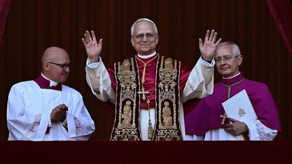 Pope Leo XIV waves to a crowd of thousands of attendees gathered in St. Peter’s Square May 8. The Papal Conclave votes are taken in secrecy, and the results of a vote are unknown until either white or black smoke is seen coming from the Sistine Chapel chimney.