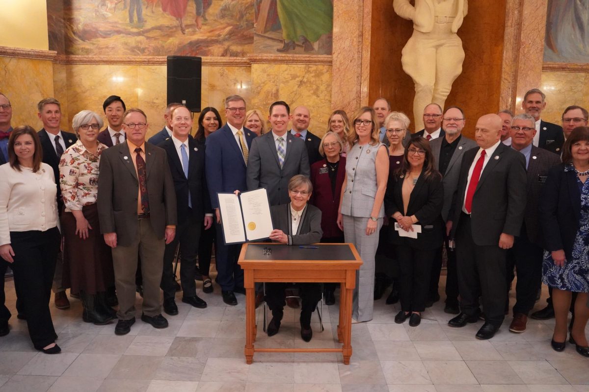 Governor Laura Kelly holds up the signed Substitute for House Bill 2299. Before being signed into law by the Governor, the bill was passed by the Kansas House 84-39 on March 10 and was previously passed by the Senate 32-4.